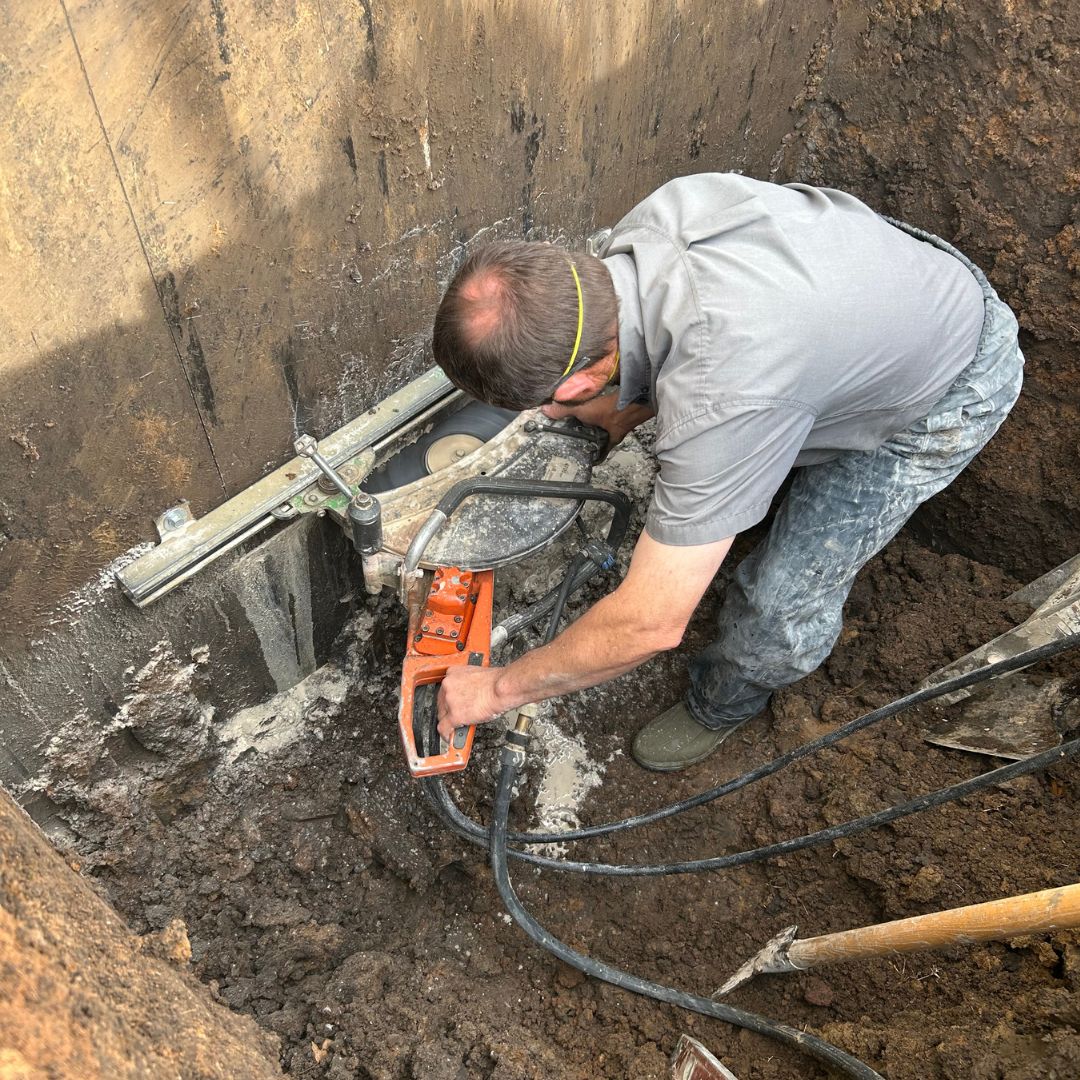 Cutting egress window opening in Kansas.