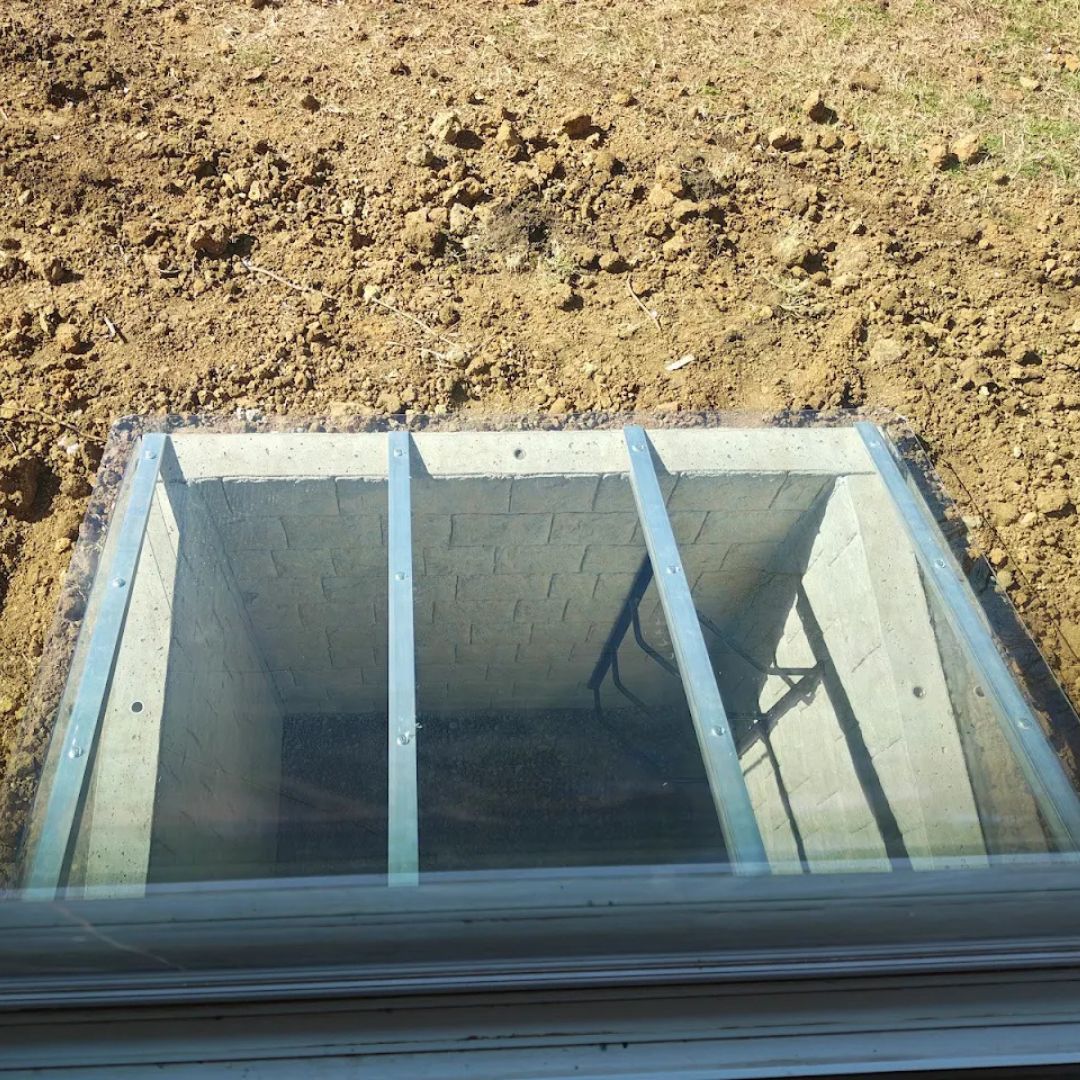 Illumicast egress window well with precast concrete well
