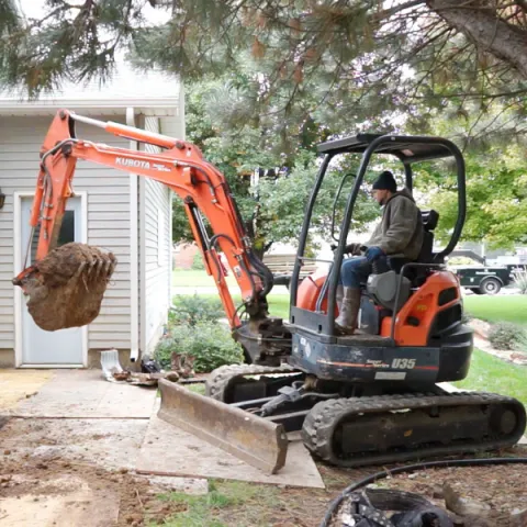 Man driving excavator